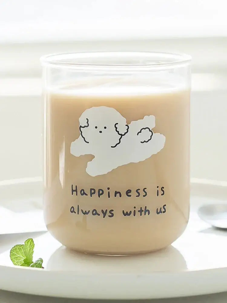 Clear glass cup featuring a cute dog glass design and happiness is always with us phrase for kitchen use