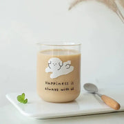 Clear glass cup with a white cloud and happiness is always with us phrase in a cute dog glass cup for kitchen use