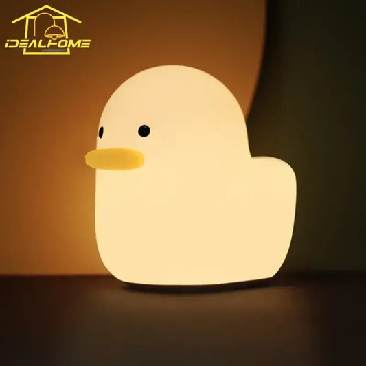 Soft glowing yellow cute dull duck night light with black eyes and bright orange beak for bedroom decorbites bedside lamp