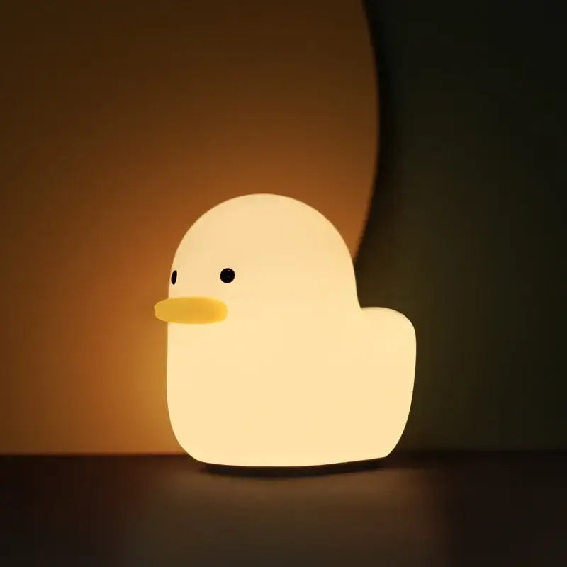 Soft glowing yellow cute dull duck night light with smooth silicone body and black beak for bedroom decorbites cute dull