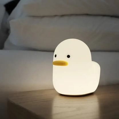 A soft white silicone cute dull duck night light with yellow beak and black eyes for bedroom decorbites cute dull lamp