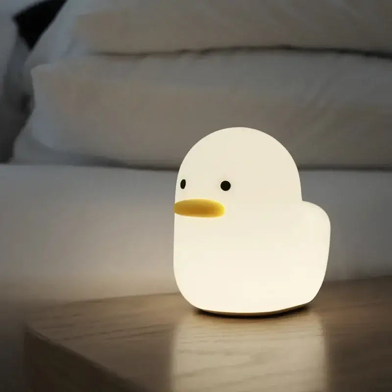 A soft white silicone cute dull duck night light with yellow beak and black eyes for bedroom decorbites cute dull lamp