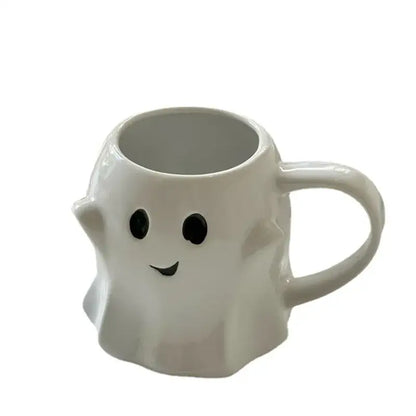 White ceramic mug shaped like a smiling ghost with black eyes from decorbites cute ghost mug set for kitchen use