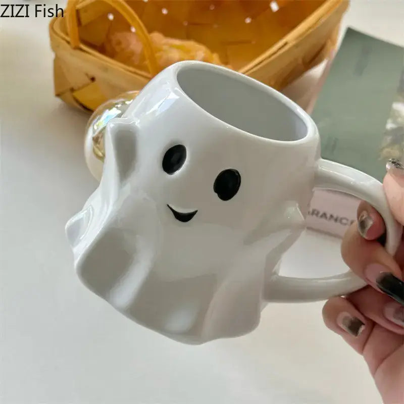 White ceramic ghost shaped ceramic mug with black eyes and smiling mouth from decorbites cute ghost mug set for kitchen use