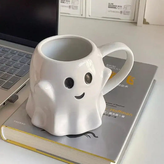 White ceramic ghost shaped ceramic mug with black eyes smiling mouth from decorbites cute ghost mug set for kitchen use