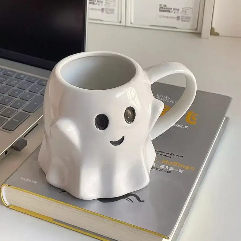 White ceramic ghost shaped ceramic mug with black eyes smiling mouth from decorbites cute ghost mug set for kitchen use