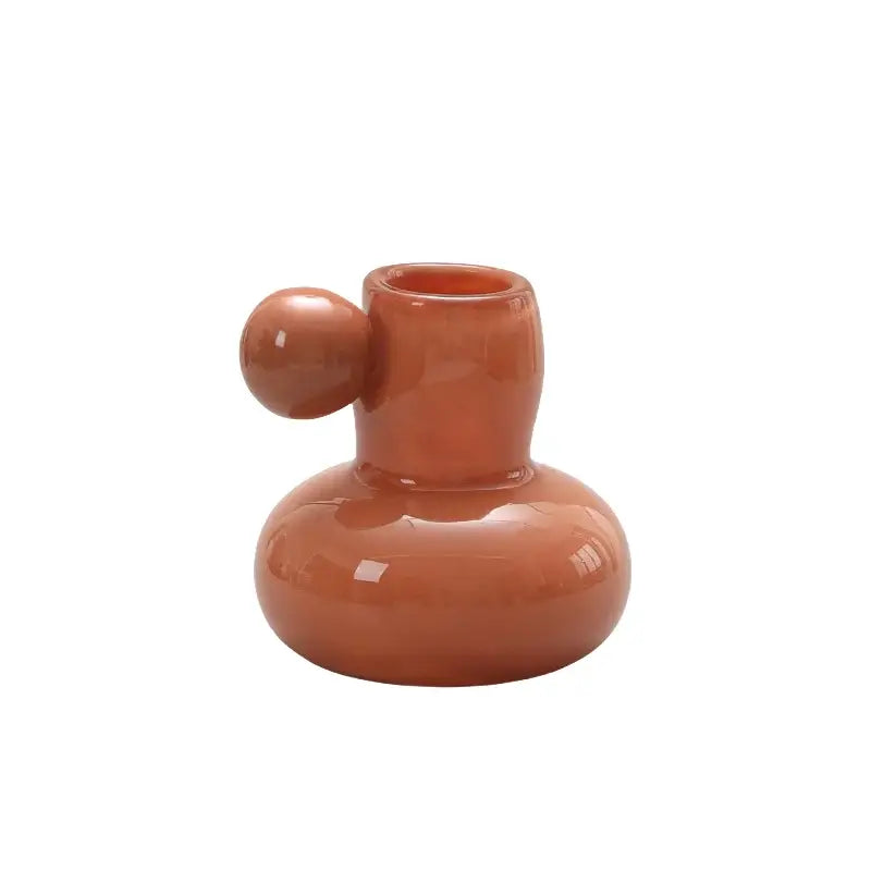 Terracotta ceramic candle holder with rounded base slender neck and spherical knob for decorbites cute glass ball decor
