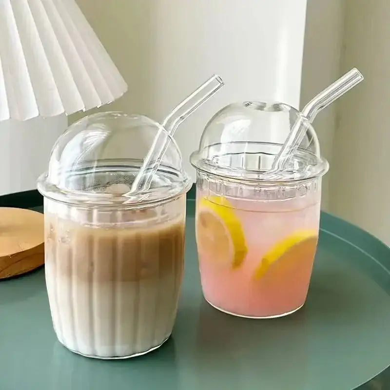 Clear glass cups with domed lids and clear straws featuring a pink bow tie design kitchen coffee tumbler