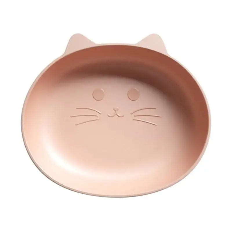 A soft pink silicone cat-shaped dish with molded ears and whiskers included in a cute green bear shape fruit plate set of 4