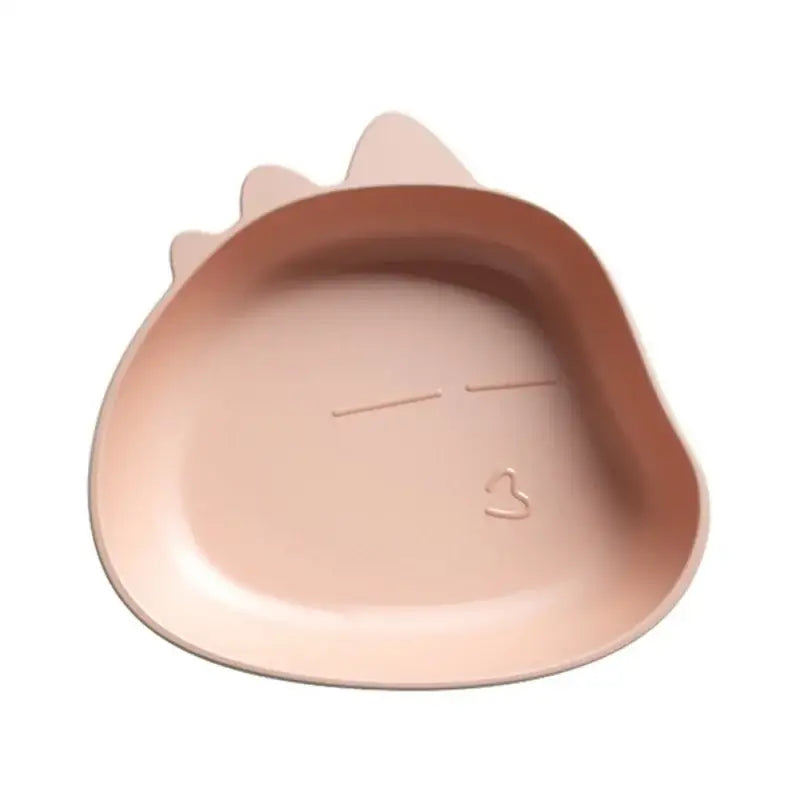 A soft pink cat-shaped dish with molded ears and a simple face design for the cute green bear shape fruit plate set