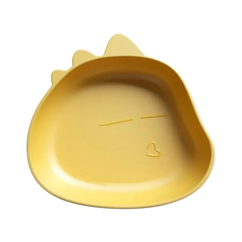 Yellow plastic dinosaur-shaped children’s plate showing textured back in a cute green bear shape fruit plate set of 4