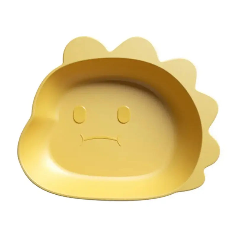 Yellow silicone fruit plate shaped like a sad sun with embossed features from a cute green bear shape fruit plate set of 4