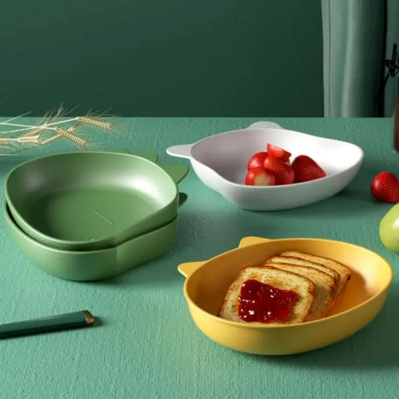 Yellow cat-shaped children’s bowl with glossy plastic finish and rounded ears in cute green bear shape fruit plate set