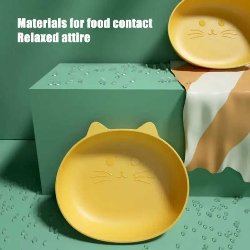 Yellow cat-shaped plate with molded ears and cute face as part of a bear shape fruit plate set of 4 for kitchen use