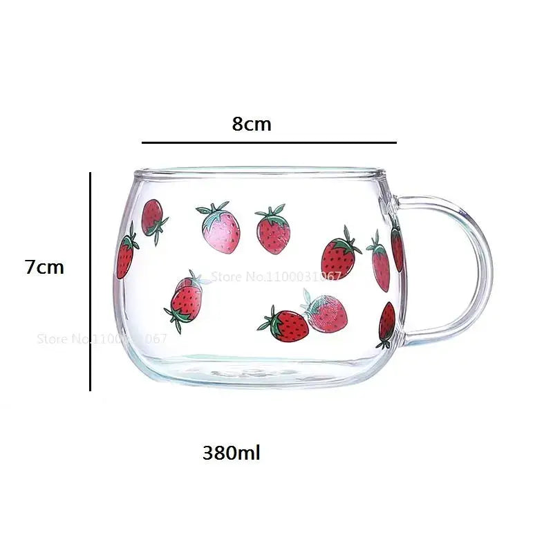 Clear glass mug with colorful red and pink strawberry illustrations and a transparent handle from decorbites cute letter glass