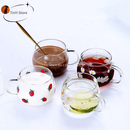 Four clear glass mugs with handles featuring decorbites cute letter designs of fruits and flowers for kitchen use
