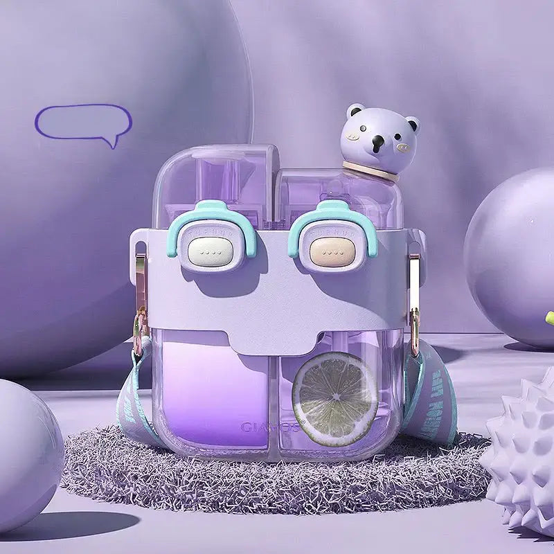 Purple translucent double-bin sippy cup with cute bear face design and mint green accents for kids kitchen use
