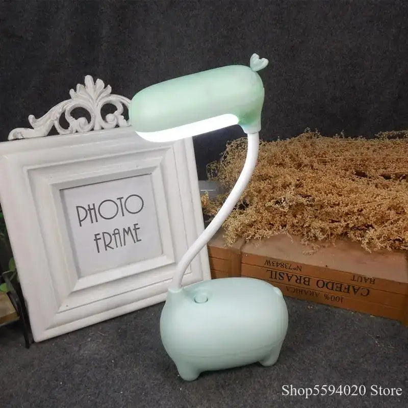 Pastel green pig-shaped elk night lamp with flexible neck and heart detail by decorbites for bedroom desk decorbites elk night