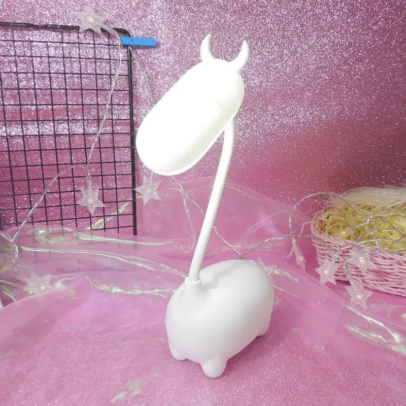 White plastic unicorn-shaped elk night lamp with curved neck for bedroom decorbites elk night desk light