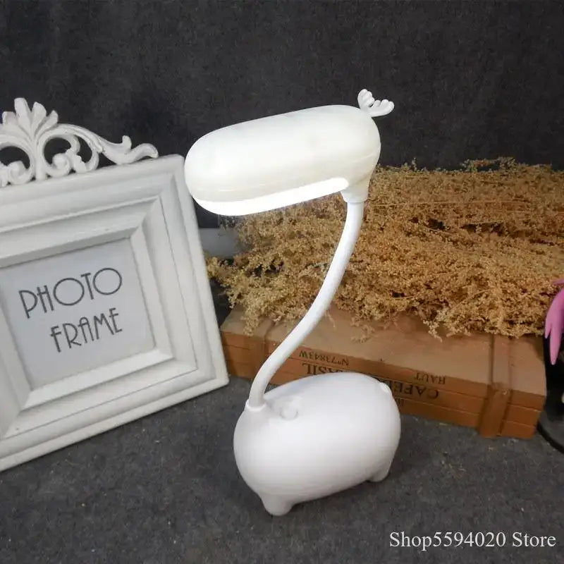 White pig-shaped elk night lamp with curved neck and small antler ears for bedroom decorbites elk night light