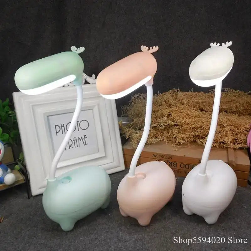 Three cute deer-shaped decorbites elk night lamps in pastel pink white and mint with flexible necks for bedroom desk lighting