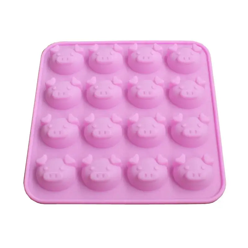 Pink silicone cute pig head cake mold with 16 cavities for baking and ice cubes in the kitchen