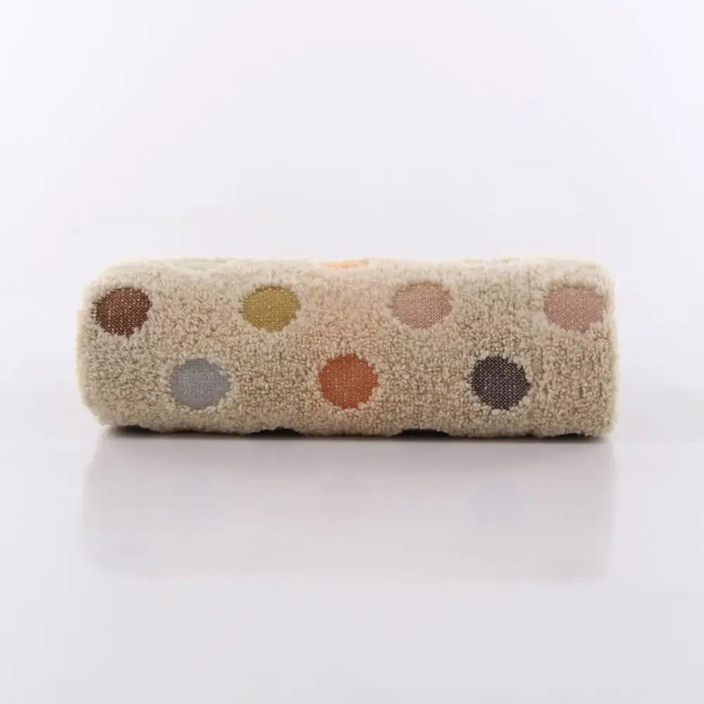 A soft beige cotton dot face towel with multicolored polka dots from the cute pink and beige face towel set by decorbites