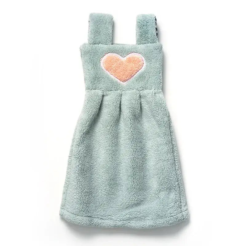 A soft mint green plush hand towel dress with a peach heart appliqué for cute cartoon hand towel kitchen decor