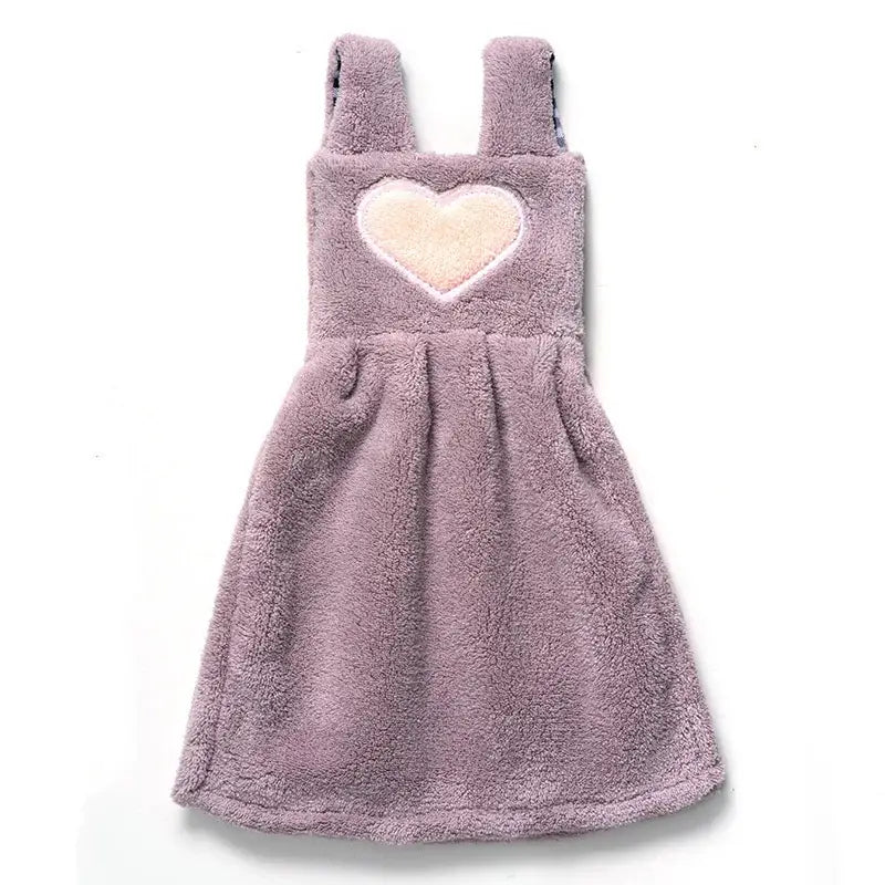 A cute lavender plush hand towel dress with soft fuzzy texture and heart patch for cartoon hand towel kitchen decor