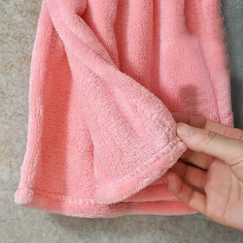 Soft pink plush cartoon hand towel with textured absorbent surface for cute kitchen decor and hand drying