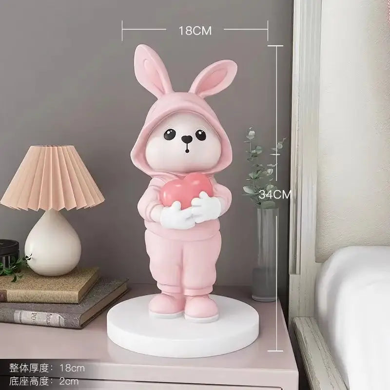 Cute pink rabbit desk figurines crafted from smooth resin with glossy finish holding heart for home decor