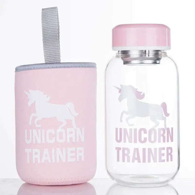 Pink unicorn trainer water bottle with matching pink lid and sleeve beside cute polar bear and seal blue glass water bottle decorbites blue glass water