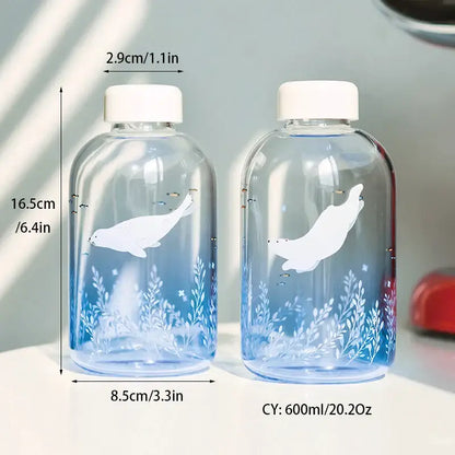 Clear glass decorbites blue glass water bottles with white seal illustrations and blue gradient detailing for drinkware
