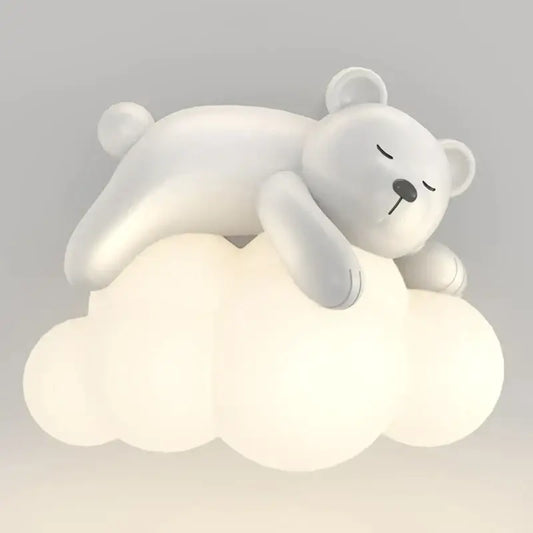 A cute polar bear soft white figurine on a glowing cloud-shaped plastic lamp for kids bedroom decor