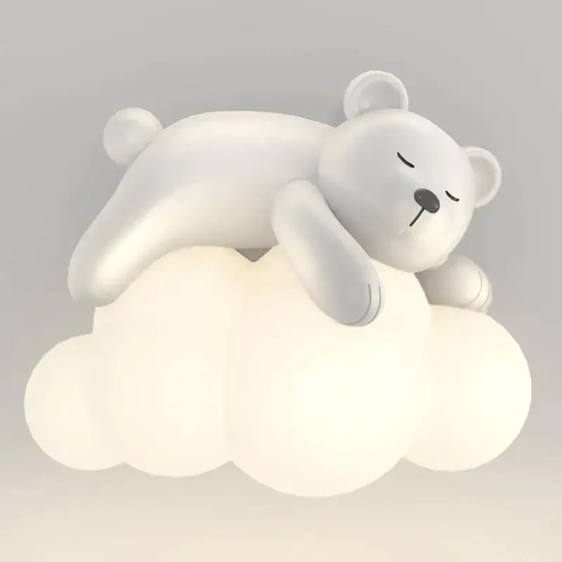 A cute polar bear soft white figurine on a glowing cloud-shaped plastic lamp for kids bedroom decor