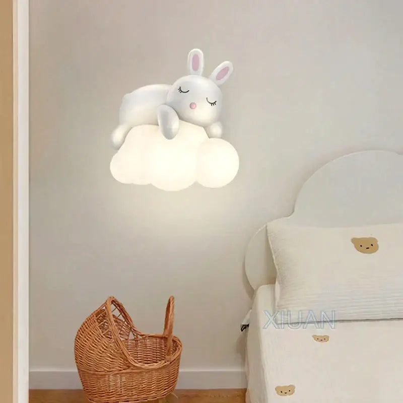 Cute polar bear cloud wall lamp for kids featuring a white bunny-shaped light with closed eyes and pink nose on a soft cloud