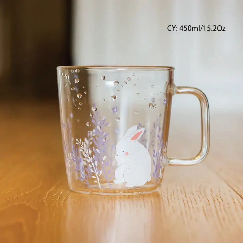 Clear glass coffee mug with white rabbit illustration purple floral patterns and heat resistant design for kitchen use