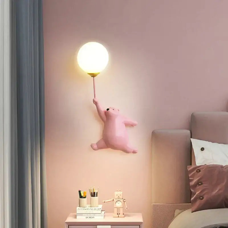 Cute pink bear wall lamp shaped like a polar bear holding a glowing round balloon for bedroom lighting