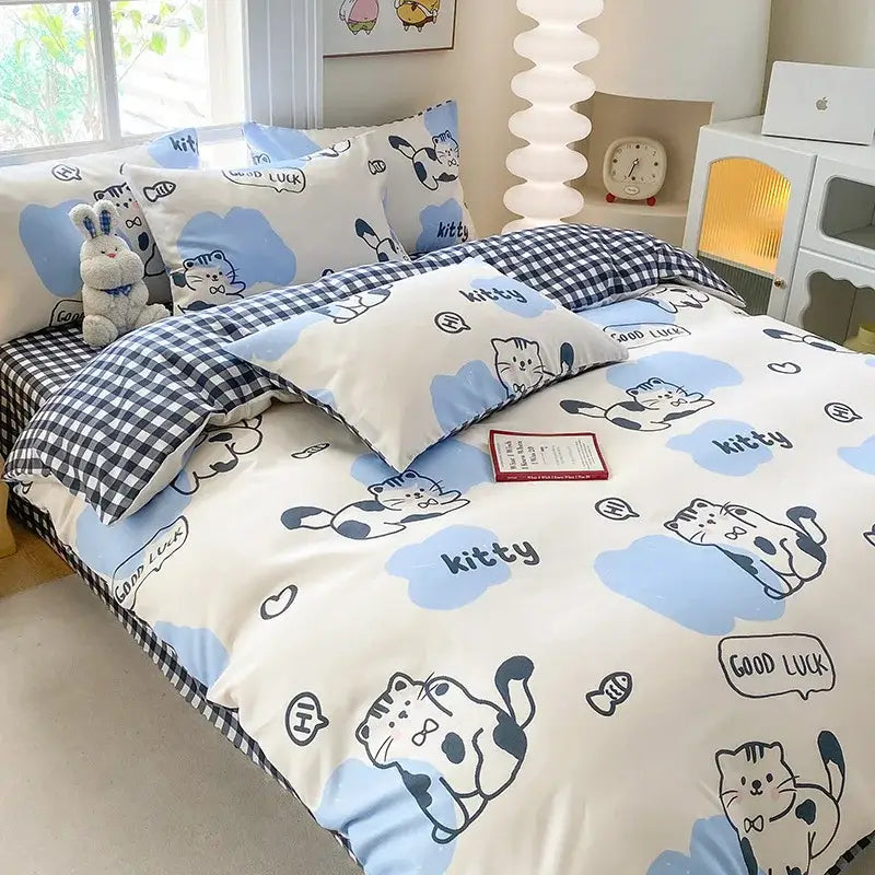 Cute printed cotton duvet cover with cream and navy colors featuring black-and-white cartoon cats and cloud patterns