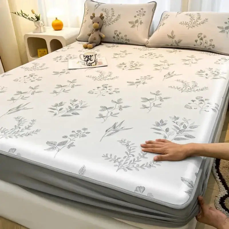 White floral-patterned mattress set with gray botanical decorbites cooling ice silk for a soft, smooth texture