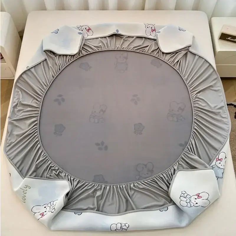 Gray elastic trampoline cover with soft ruffled edges and light blue elephant prints for decorbites cooling ice silk mattress set