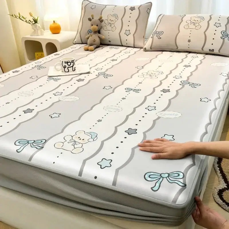 Gray and white patterned bed pad with cartoon bear stars and bows made of decorbites cooling ice silk for mattress set