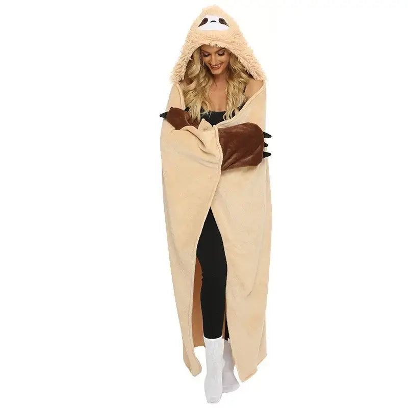 Beige cozy shawl blanket with cute sloth flannel design plush texture and brown paw-like cuffs for bedroom warmth