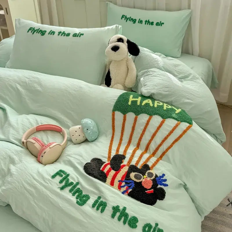 Mint green plush bed set with cartoon bear parachuting design and flying in the air text decorbites cartoon embroidery bed