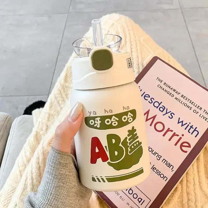 White insulated thermos cup with green and red cartoon design and clear straw decorbites cute straw for kitchen and travel