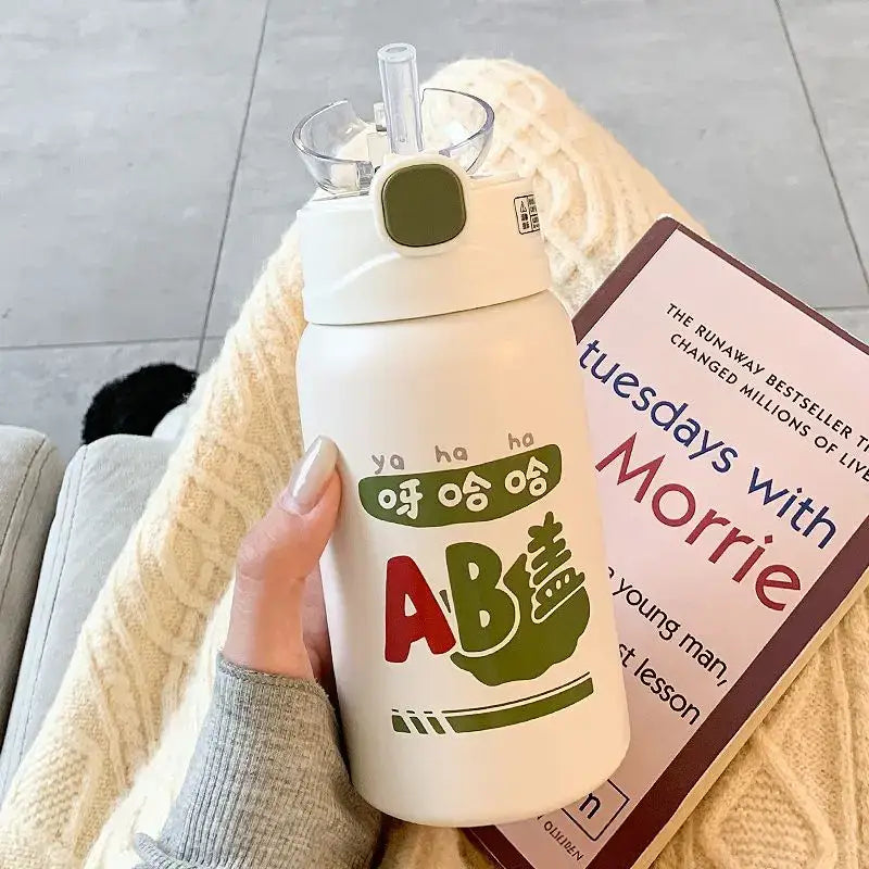 White insulated thermos cup with green and red cartoon design and cute straw lid for kitchen and travel decorbites cute straw
