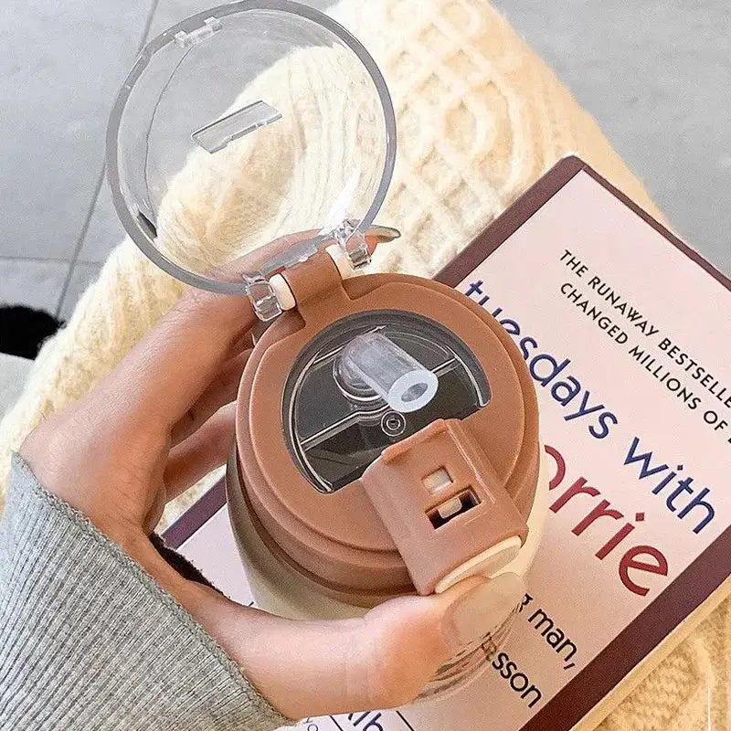 A brown plastic thermos cup with clear flip-top straw lid from decorbites cute straw for kitchen and travel use