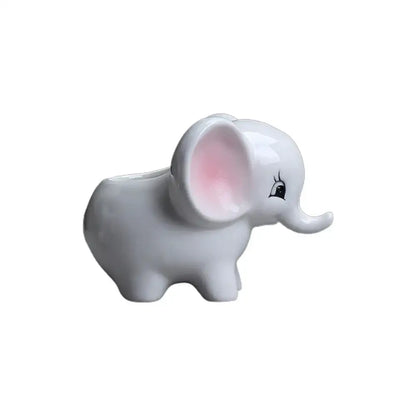 Glossy white ceramic elephant succulent planter with pink inner ears and cartoonish expression for bedroom decor