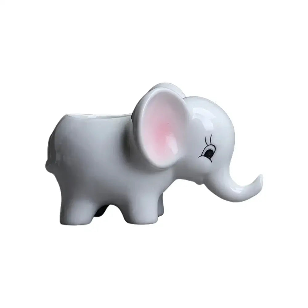 Cute white ceramic elephant succulent planter with pink inner ears and black eyelashes for bedroom decor