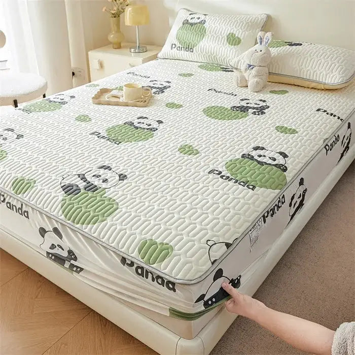 White quilted fitted sheet with cute cartoon pattern of black and white pandas and green leaves for cooling comfort